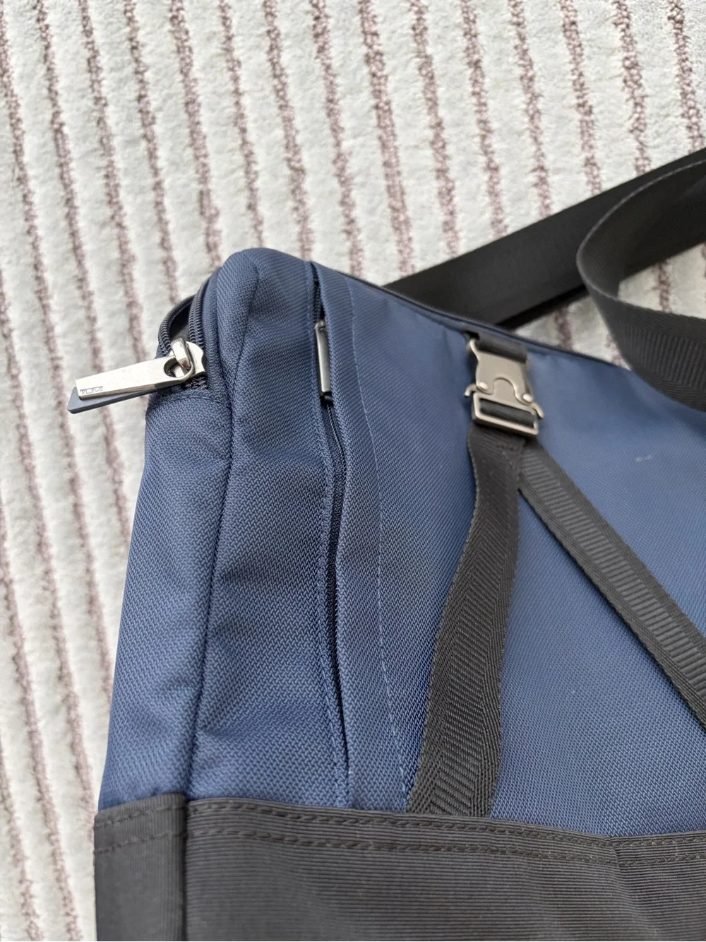Tumi Navy and Black Crossbody with Tan Logo Patch